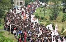 Members of NO TAV movement march during a rally towards the Chiomonte TAV worksite in Susa Valley, Piedmont Region, northern Italy, 27 July 2019. Italy would incur 'huge costs' to stop the Turin-Lyon high-speed train (TAV) link unilaterally in the face of French determination to complete the project, Italian Premier Giuseppe Conte said on 24 July, explaining his view that it would cost more to stop the TAV than to complete it. ANSA/ ALESSANDRO DI MARCO